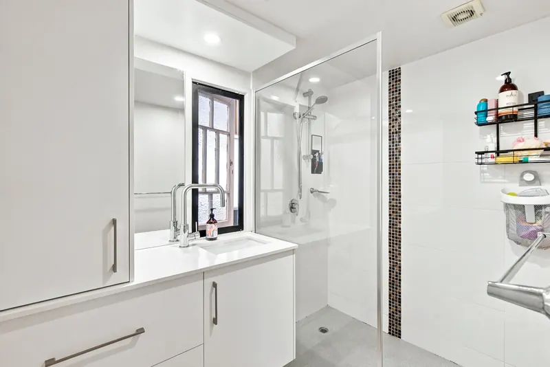 Bathroom with walk-in shower and vanity