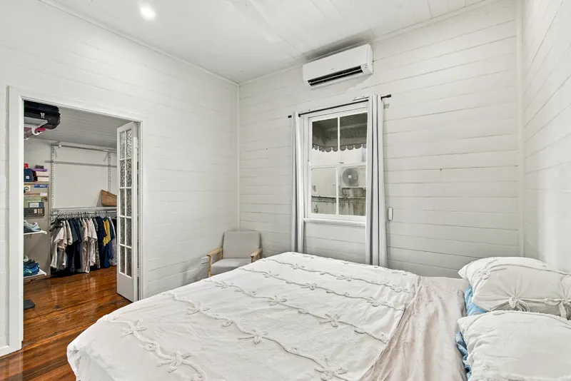 Bedroom with air conditioning and a walk-in robe